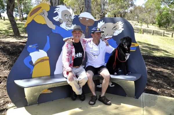 Thalassa Park Story Chair
Steve Hayter, Steve Conroy and Riley the dog enjoy the shade while sitting on 'The Magic Pudding' story chair at Thalassa Park.
