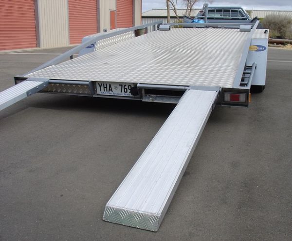Adjustable Angle Tilt Tray Car Trailer
These ramps slide under the tray and are locked away in a concealed compartment

