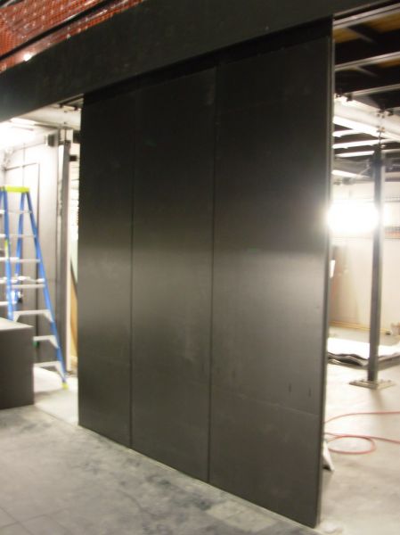 Demountable Wall
Sections of the demountable wall viewed from the orchestra pit.
The panels are constructed from lightweight materials for ease of use.
