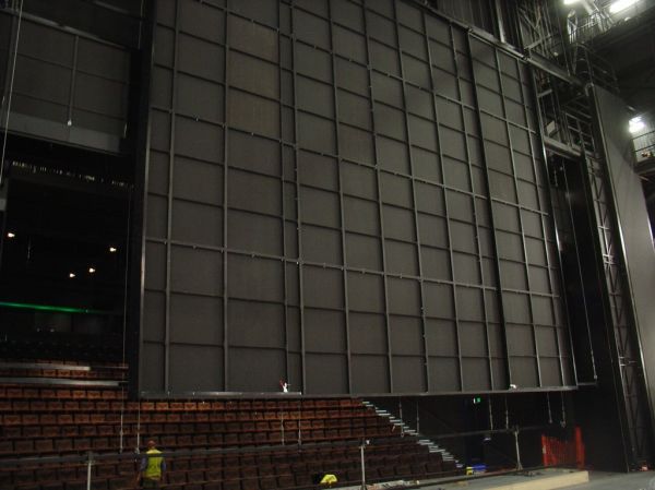 Teaser Panel
The teaser panel forms the top of the proscenium arch and can be flown in or out to vary the height of the stage opening.
The design of this venue called for a variable width teaser panel. 
This picture shows the teaser panel at minimum width.

